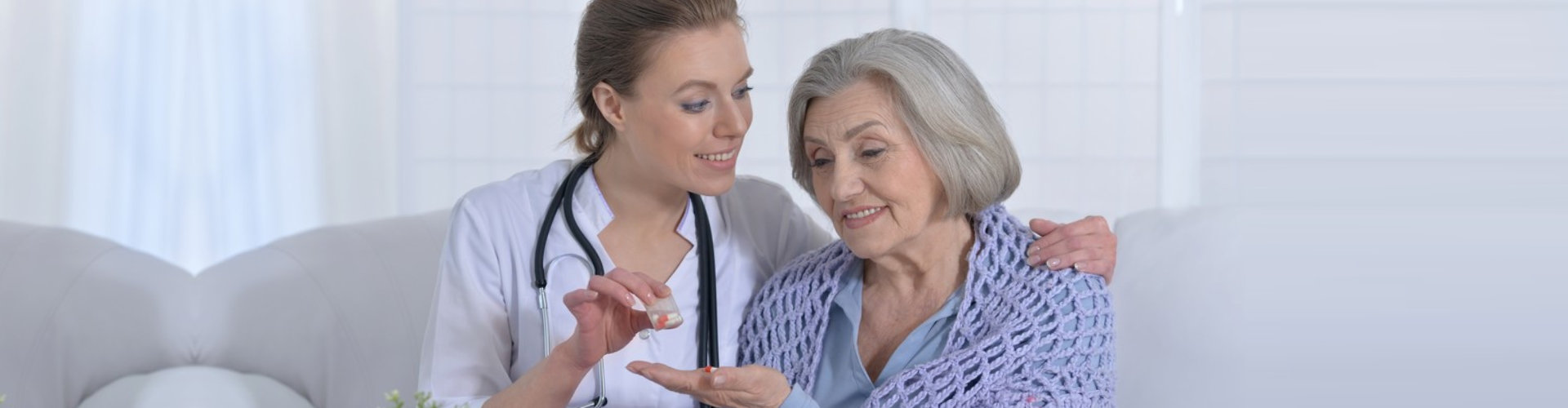 pharmacist giving patient medicine